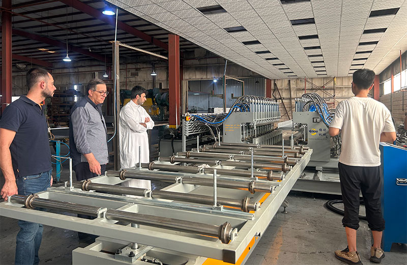 Engineers adjust ladder production equipment in Saudi Arabia